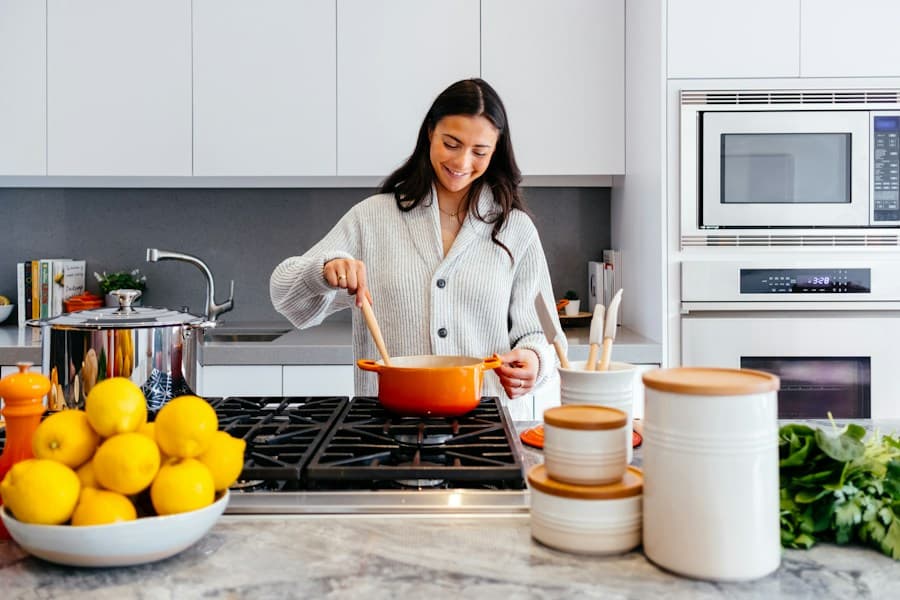 White shaker kitchen with a cook at the range