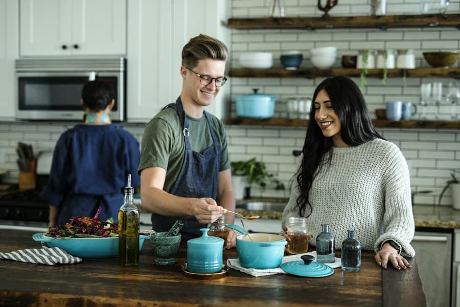 Two people cooking together in a slim-profile modern kitchen